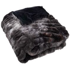 a black and grey fur blanket on a white background