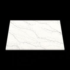 a white marble counter top on a black background