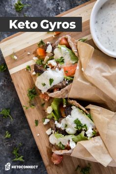 keto gyros with lettuce, carrots and cheese on a cutting board