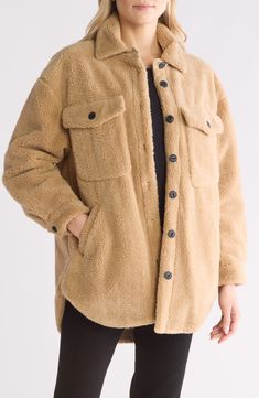 An oversized fit enhances the cozy style of a fluffy faux-shearling shirt-jacket fashioned with multiple pockets and a curved hem. 31" length (size Small) Front button closure Point collar Chest button-flap patch pockets; front welt pockets Lined, with 100% polyester fill 100% polyester faux shearling with 100% cotton contrast Dry clean Imported Cozy Long Sleeve Fur Coat With Pockets, Cozy Fluffy Long Sleeve Outerwear, Fluffy Beige Outerwear For Fall, Brown Long Sleeve Outerwear With Soft Texture, Oversized Winter Shacket For Cold Weather, Oversized Soft Outerwear For Cold Weather, Soft Sherpa Outerwear For Fall, Sherpa Long Sleeve Outerwear, Cold Weather Sherpa Outerwear With Soft Texture