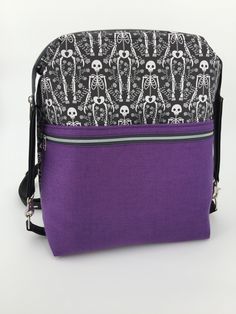 Backpack / shoulder bag in skeleton design / gothic style. Colour: purple / black Size/Dimensions/Weight: 28 cm x 33 cm x 12.5 cm Great backpack and shoulder bag in one, because you don't know when to have your hands free. By adjusting the strap, you can carry it as a backpack or as a shoulder bag. The opening of the main compartment is reinforced by brackets. Faux leather accents and great metal parts underline the design of skeletons, hearts and roses. The skeletons give this bag a unique look Black Emo Bags For Everyday Use, Purple Backpack With Zipper Closure, Halloween Standard Backpack With Zipper Closure, Purple School Bag For Halloween, Gothic Halloween Backpack, Gothic Standard Backpack For Everyday Use, Alternative Style Everyday Backpack, Punk Style Backpack With Zipper For Everyday Use, Punk Backpack With Zipper Closure For Everyday Use