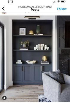 a living room filled with furniture and bookshelves on top of it's shelves