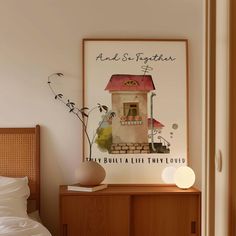 there is a poster on the wall next to a bed and nightstand with a lamp