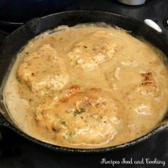 some meatballs and gravy in a skillet