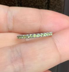 "Peridot Pave Band Full Eternity 2mm Peridot Stacking Ring Wedding, Anniversary Band Gold or Platinum Push Present Ring Peridot Maternity Ring August Birthstone Ring MaterialSolid Gold (10K, 14K, 18K) or PLATINUM 950                                      Select your choice from drop down window FinishingHigh Polished/ Shiny PlatingRhodium/ Platinum Family (ONLY if white gold selected) FitComfort/Rounded Width2mm Height2mm          SettingU Micro Pave Set (Reminds the Letter \"U\" from side) Stone Green Stackable Eternity Band For Promise, Green Stackable Eternity Band For Anniversary, Green Gemstone Eternity Band For Anniversary, Green Eternity Band With Prong Setting For Anniversary, Green Prong-set Eternity Band For Anniversary, Green Half Eternity Band For Anniversary, Stackable Peridot Anniversary Jewelry, Stackable Peridot Jewelry For Anniversary, Green Vvs Clarity Eternity Band For Anniversary