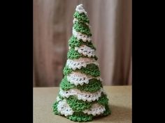 a crocheted christmas tree sitting on top of a table