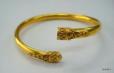 Elegant 22k Gold Bangle For Puja, Elegant Gold Bangle Bracelet For Puja, Yellow Gold Bangle Bracelet In Temple Jewelry Style, Yellow Gold Temple Jewelry Bangle Bracelet, 22k Gold Hallmarked Temple Jewelry Bangle, Ceremonial Temple Jewelry Bracelet In 22k Gold, Yellow Gold Temple Jewelry Bangle, 22k Gold Openable Bangle Bracelet, 22k Gold Openable Bangle