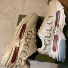 Gucci Rhyton Sneakers New Luxury Gucci Sneakers, Gucci Sporty Custom Sneakers With Logo, Gucci Custom Logo Sporty Sneakers, Designer Gucci Sneakers With Embossed Logo, Sporty Gucci Custom Sneakers With Logo, Gucci Custom Lace-up Logo Sneakers, Gucci Sneakers With Logo Detail For Sports, Luxury Gucci Sneakers With Logo, Luxury Gucci Custom Sneakers With Logo