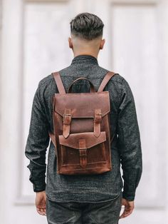 Check out our OTHER PRODUCTS https://www.etsy.com/shop/BartBag Model Simon: Compact, stylish backpack made of genuine leather with vintage style scuffs. It will match any style and occasion - it looks great both with оjeans and sneakers or dress. It is compact and roomy at the same time. * Backpack size: 10 x 14 x 4.3 '' / 25 x 35 x 11 cm. * Outer zippered pocket with the buckle: 8.3 x 5 '' / 21 x 13 cm. * Inside pocket on the back side: 7 x 6 '' / 18 x 15 cm. The main compartment closes with fa Rugged Rectangular Everyday Backpack, Everyday Rugged Leather Backpack, Rugged Leather Everyday Backpack, Leather Backpack With Leather Strap For Everyday Use, Rugged Leather Backpack With Adjustable Strap For Everyday, Brown Leather Backpack With Leather Strap, Brown Leather Strap Standard Backpack, Brown Backpack With Leather Strap For Daily Use, Classic Leather Backpack With Leather Strap For Daily Use