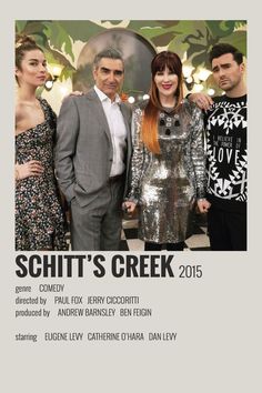 three people standing next to each other in front of a poster for the movie schit's creek