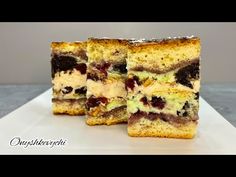 two pieces of cake sitting on top of a white plate