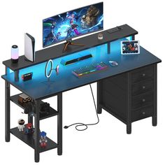 a computer desk with a monitor, keyboard and mouse sitting on it's side