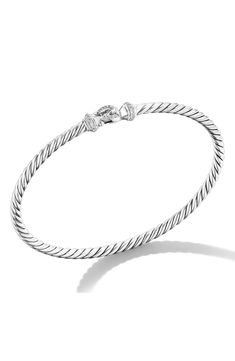 A diamond-lined buckle brings surprising detail to a sterling silver bangle crafted with a twist. Buckle clasp closure Total diamond weight: 0.1ct. Sterling silver/diamond Made in the USA or imported >Diamond Guide Classic Sterling Silver Bracelet With Single Cut Diamonds, Elegant Sterling Silver Bracelet With Clasp, Classic White Gold Bangle With Sterling Silver Clasp, Classic Formal Bangle With Sterling Silver Clasp, White Gold Bangle With Sterling Silver Clasp For Anniversary, Elegant White Gold Diamond Bracelet With Sterling Silver Clasp, Classic Bangle With Clasp, Classic Diamond Bracelet With Sterling Silver Clasp, Luxury Sterling Silver Bracelet With Cable Chain