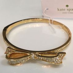 Authentic Kate Spade Hinge Bow Bracelet. 14-Karat Gold & Embellished Crystals. Comes With Dust Bag & Box. Formal Kate Spade Bracelet, Kate Spade Formal Bracelet, Kate Spade Formal Bracelet Jewelry, Kate Spade Elegant Bangle Jewelry, Kate Spade Gold Wedding Jewelry, Kate Spade Gold Bracelets, Kate Spade Bangle Bracelets For Party, Kate Spade Gold Bracelet Jewelry, Kate Spade Party Bangle