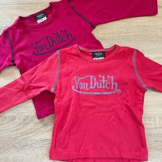 Von Dutch Girls Long Sleeve T-Shirts Size 3t, Set Of 2 In Red And Pink, Nwot - Red Wide Ribbed Tee With Light Blue Contrast Stitching And Lettering - Dark Pink Tee With Dark Blue Contrast Stitching And Lettering 100% Cotton Ribbed Tee, Dutch Girl, Von Dutch, Pink Tee, Girls Long Sleeve, Contrast Stitch, Long Sleeve T Shirts, Shirts & Tops, Dark Pink