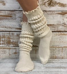 "SCRUNCHY lace ULTIMATE slouch socks - natural Slouch socks with lace top? Yes, please! Fall head over heels for our new lux cotton slouch socks! This scrumptious beige lace slouch sock is seriously soft with a natural lace trim. The absolute best way to describe this dreamy beige lace slouch sock? Super-duper-thick-cuddly-cotton-cozy-lovable-sock-itude!  Our exclusive sock, you will not find this quality sock anywhere else! 90% cotton.10% nylon fits  adult  shoe size 6-9 made in america  sock i Fitted Beige Socks For Spring, Comfortable Cream Socks, Comfortable Fitted Cream Socks, Cream Fitted Cozy Socks, Cozy Fitted Cream Socks, Fitted Cozy Beige Socks, Fitted Beige Cozy Socks, Socks With Lace, Cotton Lace Tops