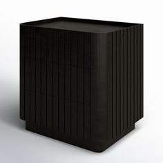 a black box sitting on top of a white floor