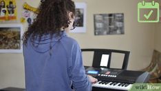 a woman standing in front of a keyboard