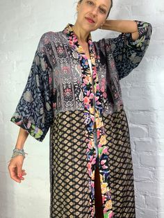 "This is super stylish kimono robe made free size with wrap tie closing easy fit all ladies, feels very comfortable and light Can be used as an everyday robe or boho street style over all with jeans and t shirt It is made one of a kind, patchwork from varieties of different floral silky materials MEAESURE shoulder 17\" length 55\" MATERIAL *poliester, no lining more available at https://www.etsy.com/shop/AltheaStores?ref=seller-platform-mcnav CARE INSTRUCTIONS * Wash in warm water * Hand wash re Silk Long Kimono For Beach Cover-up, Silk Long Kimono For Loungewear, Bohemian Long Kimono One Size, Hippie Style One-size Kimono, Bohemian Long Free Size Kimono, Bohemian Free Size Long Kimono, Bohemian Long Free-size Kimono, Bohemian Free-size Long Kimono, Long Printed Hippie Kimono