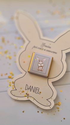 a close up of a rabbit pin on a card