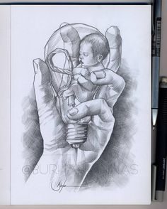 a drawing of a person holding a lightbulb in their hand with the image of a baby inside it