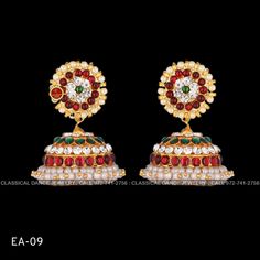 Design by Classical Dance Jewelry® ❥ Colorful and Designer traditional big pearl top and butta or Jhumka Kemp temple Indian Jewelry Earrings in Red and Green stones ❥ Model no: EA-09 ❥ Age : 10 yrs and up ❥ You Can wear this set especially for Bharatnatyam And Kuchipudi Dance Performances and in Parties, Engagement, Weddings, Birthdays. ❥ Handmade Indian Item. Size in CM (approximately) ☛ Top - 1.5 to 2 CM ☛ jhumka - 3 to 4 CM Set includes ☛ Earrings pair ❇️ Imitation Jewelry by nature is little Red Jhumkas For Ceremonial Use During Diwali, Traditional Heavy Earrings For Puja, White Cutdana Jhumkas For Celebration, Festive Temple Jewelry Bridal Earrings With Zari Work, Temple Jewelry Style Bridal Earrings With Zari Work, Temple Jewelry Bridal Earrings With Zari Work, Celebration White Cutdana Jhumkas, Cutdana Earrings For Puja During Navratri, Temple Jewelry Style Chandbalis For Ceremonial Occasions