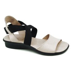 a woman's white sandal with black straps