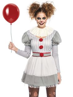 a woman dressed in a clown costume holding a red balloon