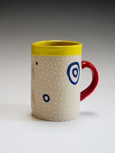 a coffee mug with an eye on it