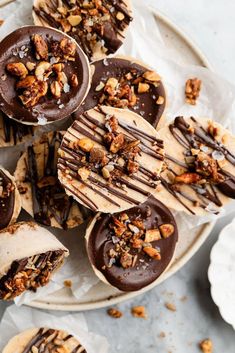 chocolate covered desserts with nuts on top