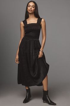 Rendered in a satin shade only-at-Anthro , the Violet Midi Dress by Damson Madder features a shirred bodice with a square neckline that flows to a midi-length skirt. | Violet Satin Midi Dress by Damson Madder in Black, Women's, Size: 10, Polyester/Viscose/Ecovero at Anthropologie Fitted Bodice Midi Dress With Smocked Back, Fitted Bodice Smocked Back Midi Dress, Midi Dress With Smocked Back And Fitted Bodice, Elegant A-line Midi Dress With Smocked Back, Knee-length Smocked Bodice Evening Midi Dress, Knee-length Smocked Bodice Midi Dress For Evening, Ruched Dress With Flowy Skirt For Night Out, Satin Midi Dress With Square Neck And Fitted Bodice, Satin Midi Dress With Ruched Bodice