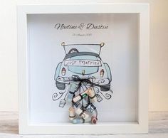 a white frame with a drawing of a car and wine bottles tied to the front