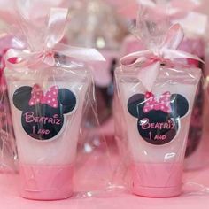 two minnie mouse cups are wrapped in plastic