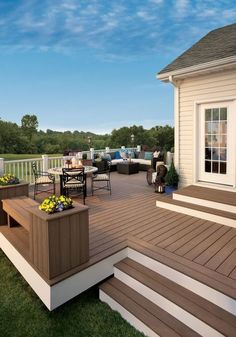 a deck with steps leading up to the patio