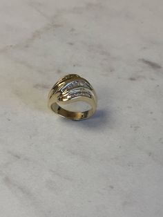 A stunning 14kt Yellow Gold Lady's Cubic Zirconia Baguette Channel Set Band with 1.50ct approx. total weight of all channel set straight baguette Cubic Zirconia (CZ) stones in finger size 7. This ring can be resized for an additional $95.00 upon request. The ring weighs 7.25 grams. Excellent band as a Wedding/Anniversary Gift. This item would Retail for $1,279.00 Wedding Anniversary Gift, Channel Set, Gold Hoop, Mens Wedding Bands, Wedding Anniversary Gifts, Cz Stone, Gold Hoop Earrings, Wedding Men, Online Jewelry