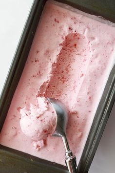 a scoop of ice cream in a metal container