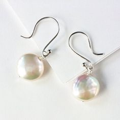 White Coin Pearl Earrings Classic Round Pearl Earrings For Everyday, Classic Nickel-free Pearl Earrings, Classic Everyday Nickel Free Pearl Earrings, Classic Hypoallergenic Pearl Earrings, Classic Silver Pearl Earrings For Everyday, Minimalist Pearl Earrings With Charm, Everyday White Pearl Pendant Earrings, Classic Sterling Silver Pearl Necklace For Everyday, Everyday Round Hypoallergenic Pearl Earrings