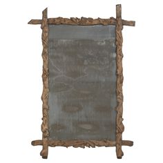 an old wooden frame with two crosses on the top and one at the bottom that has been carved into it