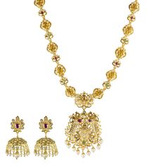 Elevate your bridal ensemble with this elegant 22k yellow gold and gemstone necklace and earrings set by Virani Jewelers. Crafted with precision and adorned glimmering emeralds, rubies, cubic zirconia, and pearls, this gold bridal jewelry set exudes sophistication and charm. Embrace the beauty of gold temple jewelry craftsmanship and make a statement of refined taste with this exquisite necklace and Chandbali earring set.Features• 22k yellow gold• Emerald• Ruby• Pearl• Cubic zirconiaNecklace Spe Gold Temple Necklace With Ruby Gemstones, Luxury 22k Gold Emerald Temple Necklace, Gold Ruby Kundan Temple Necklace, Luxury Yellow Gold Ruby Temple Necklace, Luxury Gold Dual-tone Temple Necklace, Gold Temple Jewellery, Gold Bridal Jewellery Sets, Chandbali Earrings, Temple Jewellery