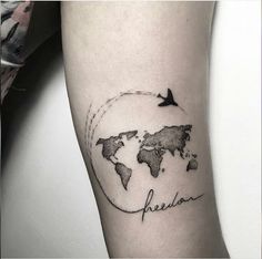 a black and white world map tattoo on the arm