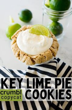 key lime pie crumbl cookies on a striped napkin with limes in the background