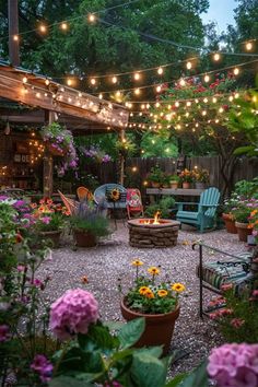 an outdoor patio with lights strung over it and potted plants in the foreground