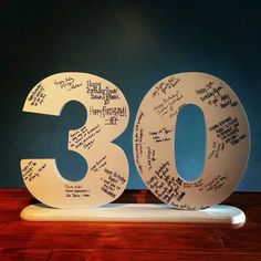 the 30th birthday cake is decorated with handwritten words