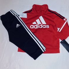 New With Tags. Adidas Boys Toddler Polyester Blend Warmer Set. Red & Black With White Trim And 2 Pocket Design With Full Zip Front. Banded Wrist Opening Offers Comfort Placement With "Adidas" Inscription On Front Of Jacket Top. The Bottoms Are Black With Elastic Waistband With Adidas Inscription On Left Upper Leg With 3 Stripes Down Each Outer Leg. Set First 12 Months Infant Boys. Great Set At A Great Price. Any Questions Please Contact Me. Thanks!!!! Sporty Red Long Sleeve Set, Adidas Casual Sportswear Sets, Adidas Fitted Playwear Sets, Adidas Cotton Sets For Winter, Adidas Fitted Sets For Playwear, Adidas Fitted Winter Sets, Adidas Cotton Winter Sets, Winter Adidas Fitted Sets, Sporty Red Playwear Set