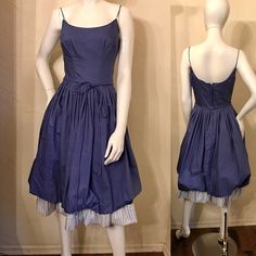 "1950's Periwinkle cotton Sundress with bubble hem. This is a darling little dress in such a pretty color. It has the fitted bodice with scoop neck and spaghetti straps and the that full pleated skirt with the bubble hem and stripe ruffle. Sooooo adorable. It also has a matching cord tie belt and a full metal zipper up the back. Only a Union tag remains. It is in very good condition. Bodice is lined in muslin and skirt is lined in a satin acetate with a layer of tulle netting in between dress an Blue Knee-length Cotton Vintage Dress, Blue Cotton Knee-length Vintage Dress, Vintage Cotton Fit And Flare Dress, Vintage Dresses With Gathered Skirt For Daywear, Vintage Daywear Dresses With Gathered Skirt, Blue Cotton Dress With Gathered Skirt, 1950s Style Cotton Blue Dress, 1950s Style Blue Cotton Dress, 1950s Blue Cotton Dress