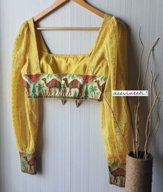 This Made to Order/Made to Measurement/Custom Made Indian Ethnic Blouse. - Fabric - Mul Cotton with Gold Mukaish Dots - Color - Yellow - Padded - Princess Cut - U Neck - Puffed Full Length Sleeves with Multicolor Border - Back Hook Closure - Border at the back Fabric Care : Dry Clean Only Disclaimer: The actual color of the product might slightly differ from the image due to photographic lighting or monitor's display Shipping: This is made to order product. Once you place the order we will provi Traditional Fitted Lehenga For Summer, Fitted Traditional Lehenga For Summer, Fitted Traditional Summer Lehenga, Bohemian Embroidered Fitted Saree, Fitted Bohemian Saree With Embroidery, Fitted Bohemian Embroidered Saree, Traditional Chanderi Blouse For Summer, Bohemian Chanderi Blouse For Festive Occasions, Semi-stitched Bohemian Blouse