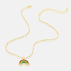 Rock a dazzling dash of color in Em + Liv's CZ Rainbow Necklace, featuring an array of sparkly clouds attached to a dreamy rainbow pendant. Wear this gem with a cute choker, and a vibrant blouse for a chic, layered look that'll make heads turn anywhere you go. Sterling Silver 14K Gold Plated Cubic Zirconia Stones Length: 14" + 3" Extender Trendy Jewelry For Pride Gifts, Trendy Rainbow Necklace For Parties, Rainbow Choker Necklace As A Gift, Rainbow Choker Necklace As Gift, Trendy Rainbow Jewelry For Pride, Trendy Rainbow Choker Necklace, Rainbow Pendant, Gold Bond, Rainbow Necklace