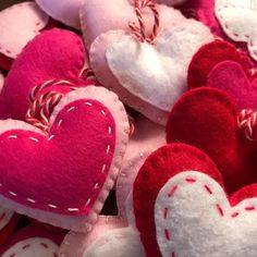 several red and white heart shaped cushions