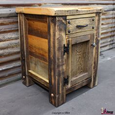 an old wooden cabinet sitting on the ground