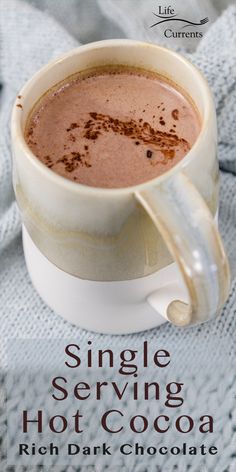 a cup of hot chocolate sitting on top of a table